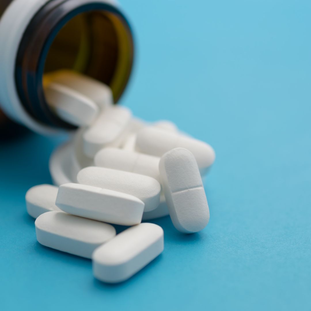 bottle with pills falling out