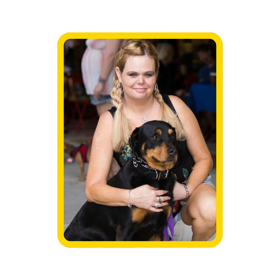 Lori's team photo, pictured with a pup!